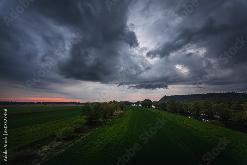 Dark storm clouds in the evening sky at the Danube in Bavaria, Germany