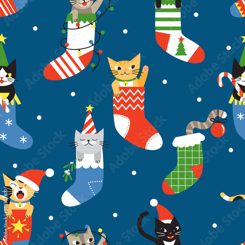 Seamless Christmas pattern with cute cartoon cats in socks