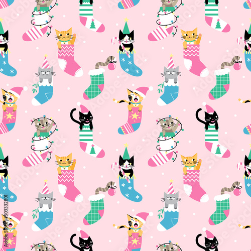 Seamless Christmas pattern with cute cartoon cats in socks