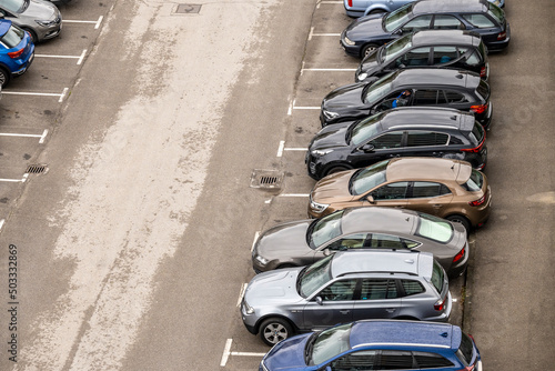 Parked cars in the Zagreb city, still wet after morning rain photo