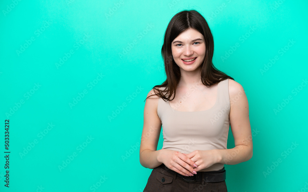 Young Russian woman isolated on green background laughing Young Russian woman isolated on green background laughing