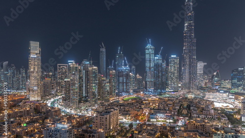 Dubai Downtown night timelapse with tallest skyscraper and other towers
