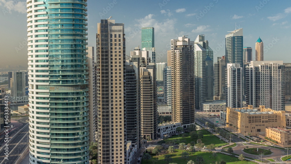 Dubai's business bay towers aerial morning timelapse. Rooftop view of some skyscrapers