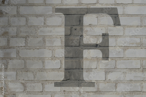 Gray letter F painted to brick wall on white background (from a letter set containing B, C, D, F, G, M, R and 1, 3, 4)