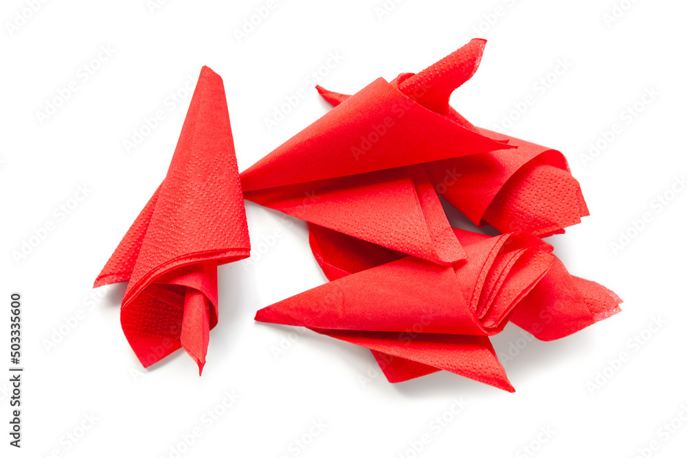 Paper napkins. Pile of red paper napkins on a white. Selective soft focus.