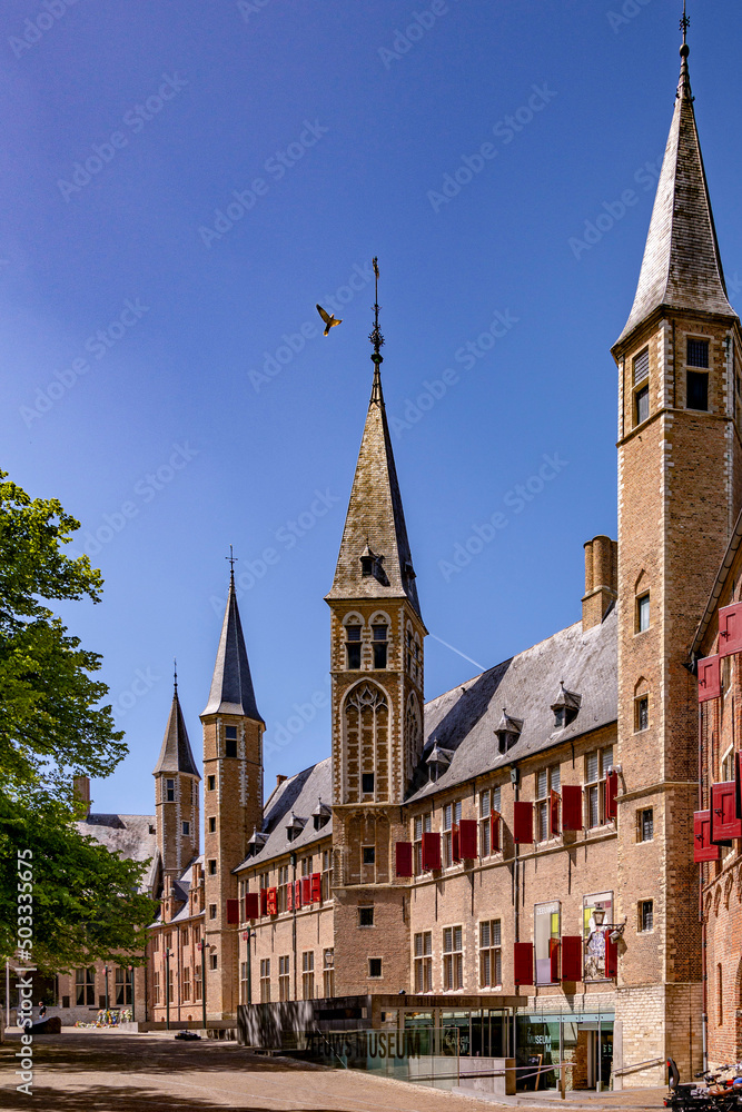 Beautiful perspective view of an old monastery museum facade on a bright blue sky summer day