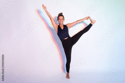Wallpaper Mural Positive woman doing Extended standing hand to big toe asana Torontodigital.ca
