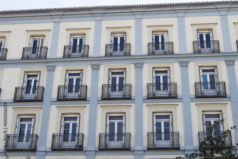 facade with symmetrical balconies in an office building in Madrid.