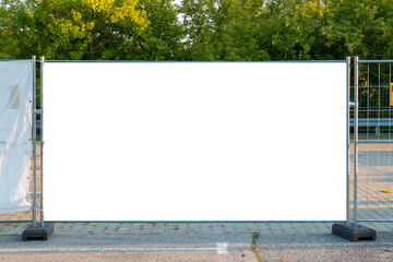 Blank white banner for advertisement on the fence of construction site