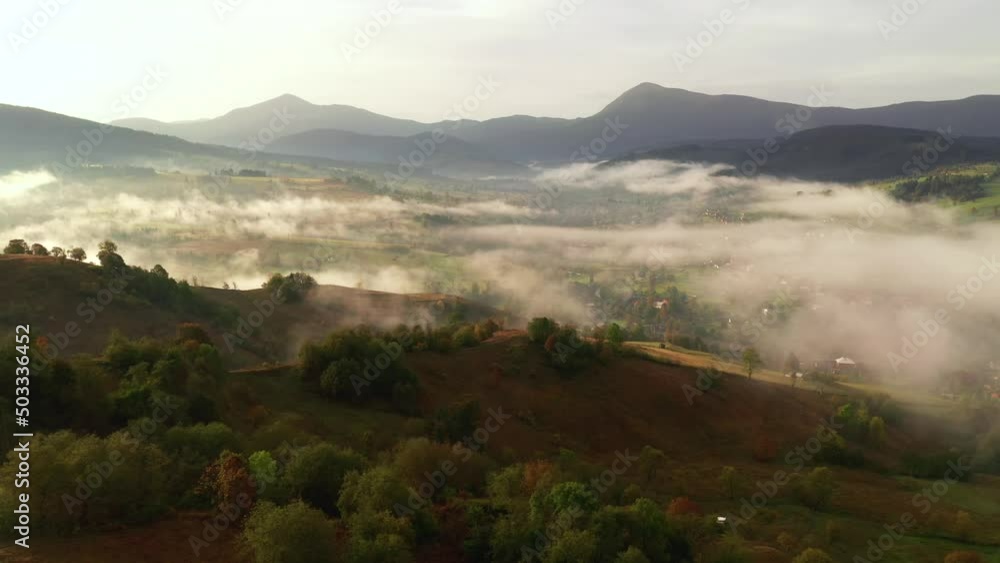 Dramatic rural landscape with fresh fog from a bird's eye view. Dramatic rural landscape with fresh fog from a bird's eye view.