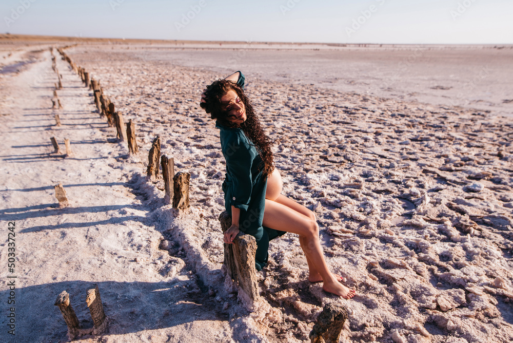Beauty Pregnant woman posing at salt desert Beauty Pregnant woman posing at salt desert