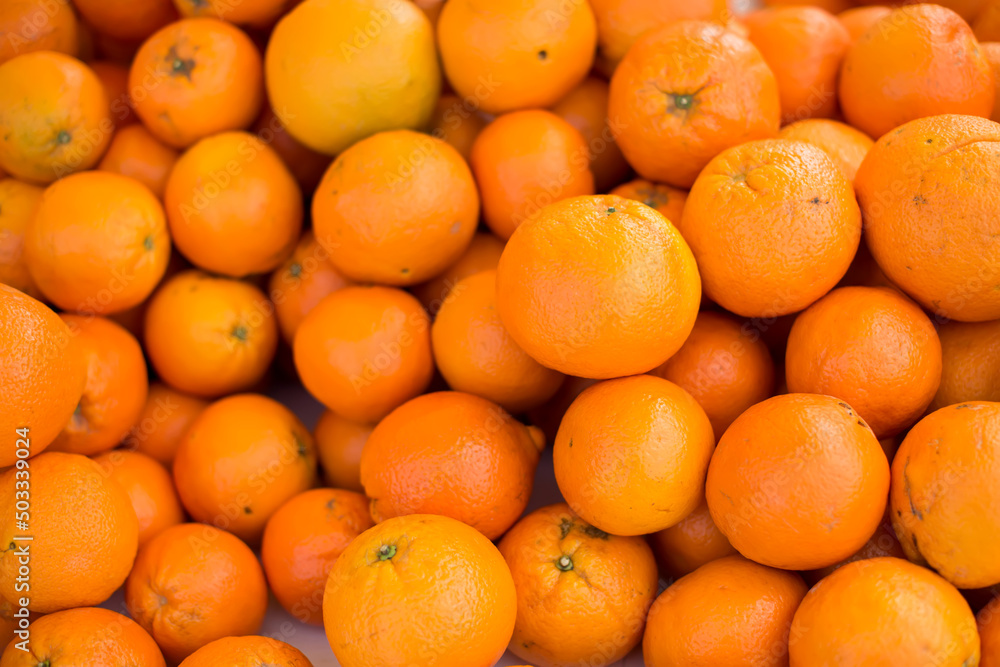 Oranges on sale at the local market. Oranges background Oranges on sale at the local market. Oranges background