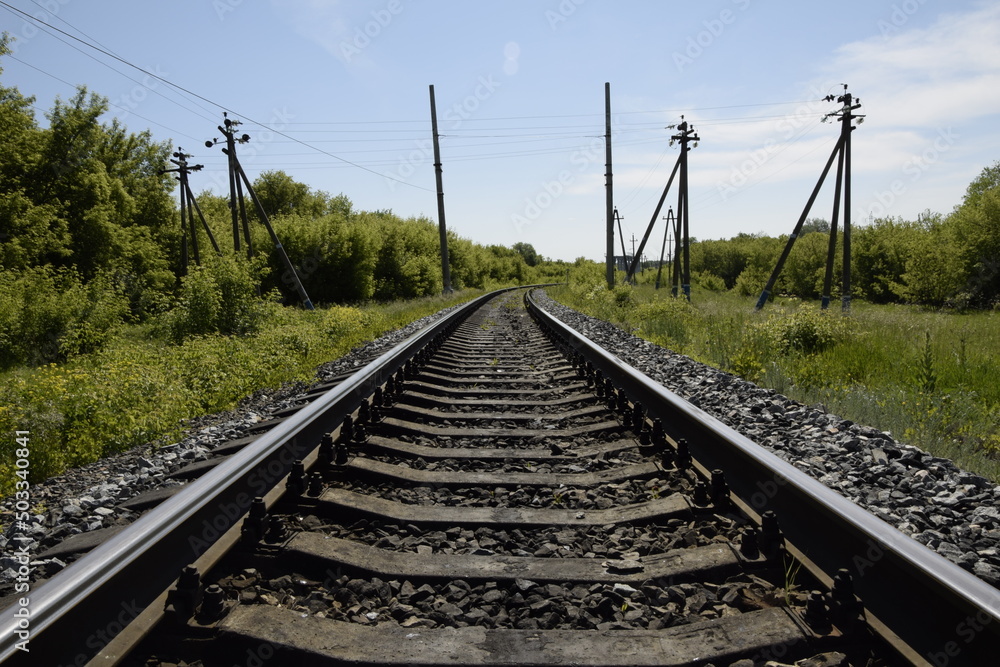 Fototapeta premium Railway rails snapshot from the lowest point.