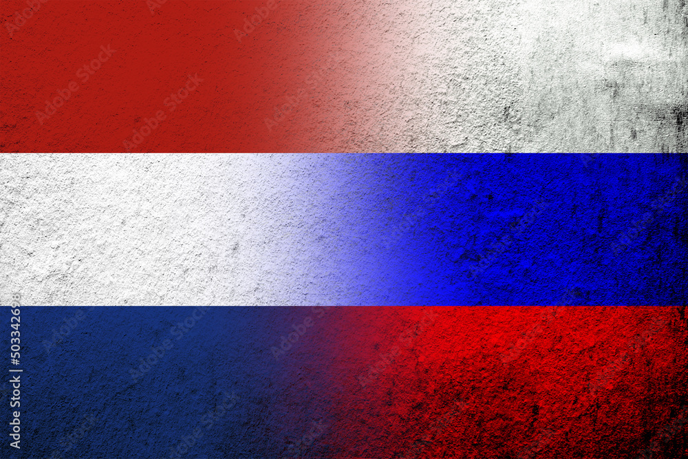 National flag of Russian Federation with The Kingdom of the Netherlands National flag. Grunge background National flag of Russian Federation with The Kingdom of the Netherlands National flag. Grunge background