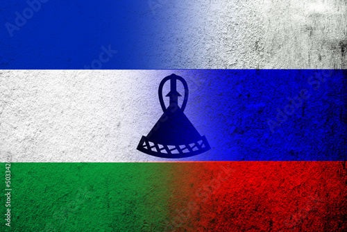 National flag of Russian Federation with The Kingdom of Lesotho National flag. Grunge background