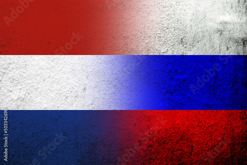 National flag of Russian Federation with The Kingdom of the Netherlands National flag. Grunge background