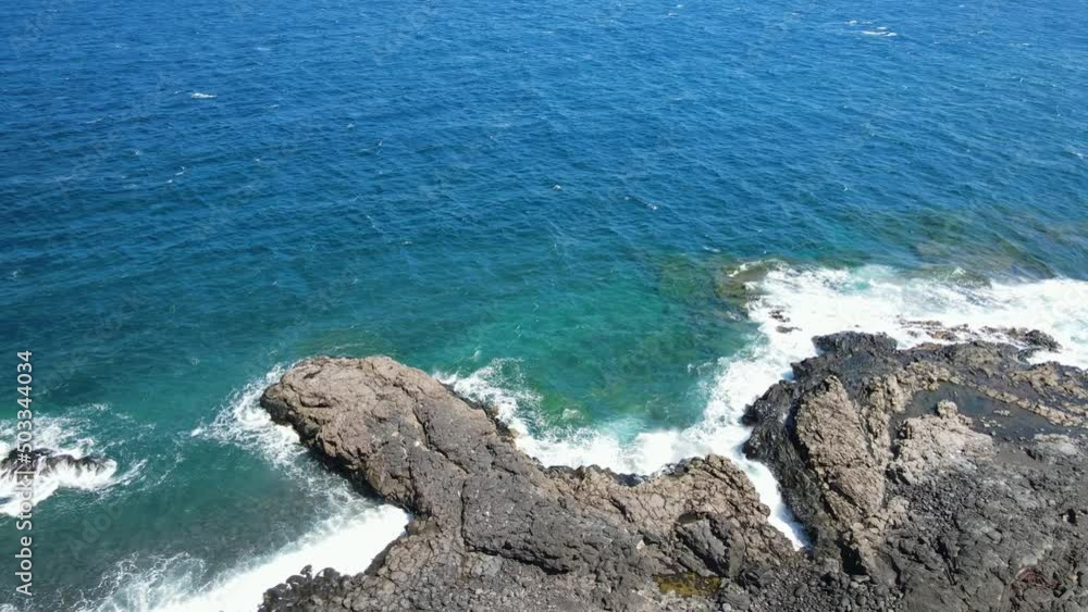 Drone shot of a blue Ocean seascape and the volcanic coast of El Hierro Drone shot of a blue Ocean seascape and the volcanic coast of El Hierro