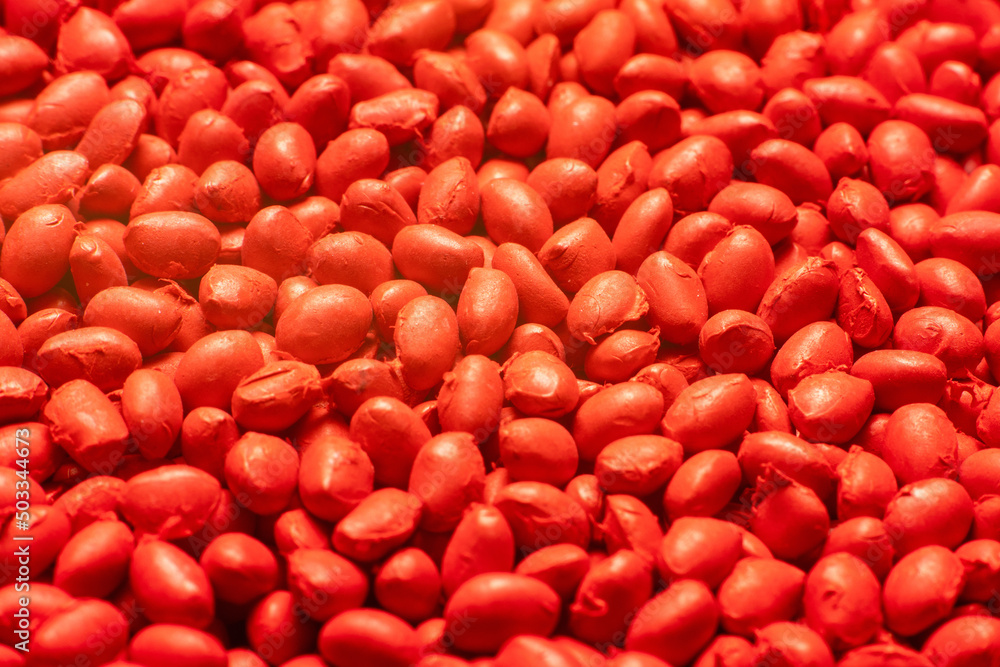 Red polymer dye in granules, background texture Red polymer dye in granules, background texture