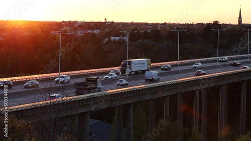 Stockholm, Sweden Traffic on the E4 highway or Essingeleden at sunset. photo