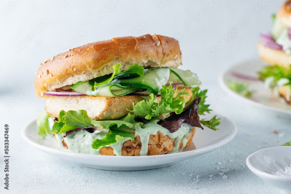 Tofu burger with vegetables on plate Tofu burger with vegetables on plate