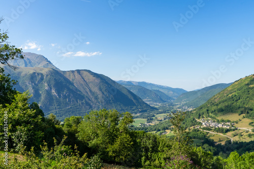 view of valley Aure in the french pyrenees mountains on a cloudy day with typical pyrenean village in altitude