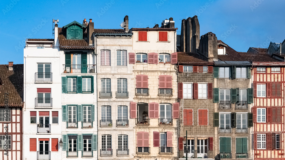 Bayonne in the pays Basque, typical facades with colorful shutters in the historic center
