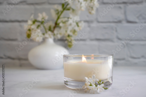 aroma candle flower lilac in the apartment