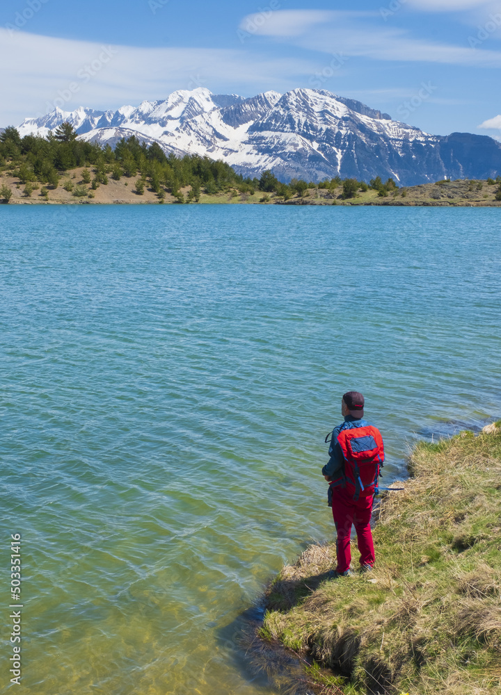 Hiker looking at the landscape in the Ib?n de Tramacastilla (or das Pa?les), Tena Valley, Huesca.