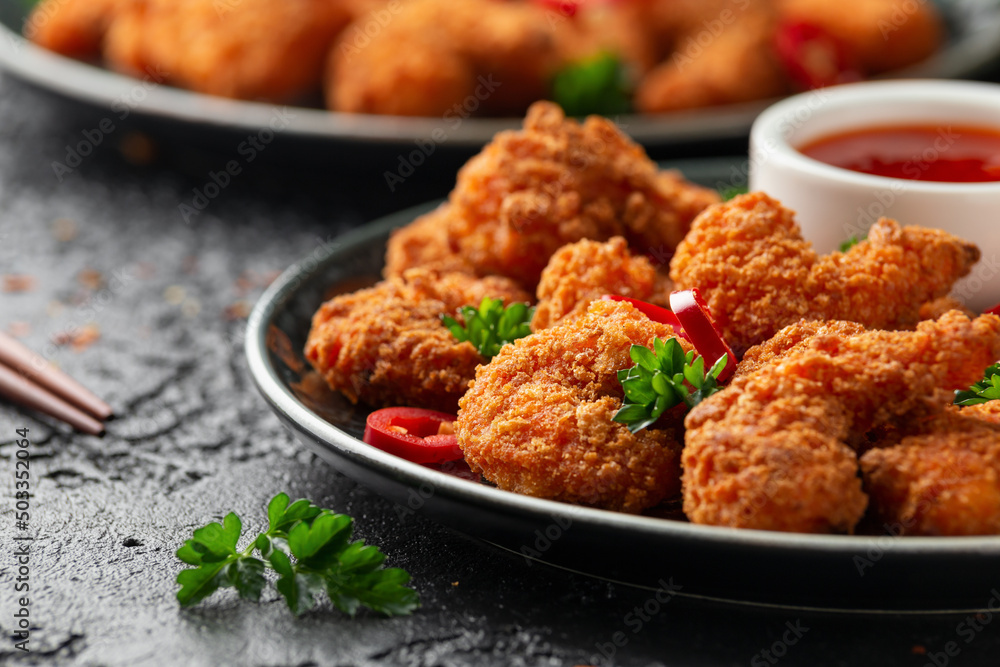 Crispy Prawns in breadcrumbs. Served with cabbage, carrot salad and soy and sweet chilli sauce Crispy Prawns in breadcrumbs. Served with cabbage, carrot salad and soy and sweet chilli sauce