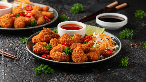 Crispy Prawns in breadcrumbs. Served with cabbage, carrot salad and soy and sweet chilli sauce