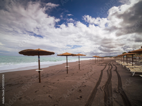 Stampa su tela beach with umbrellas in Giardini Naxos