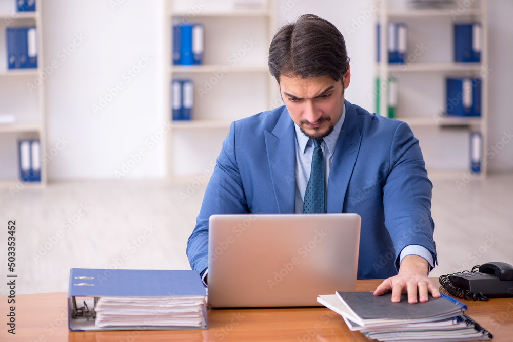 Young businessman employee working in the office Young businessman employee working in the office