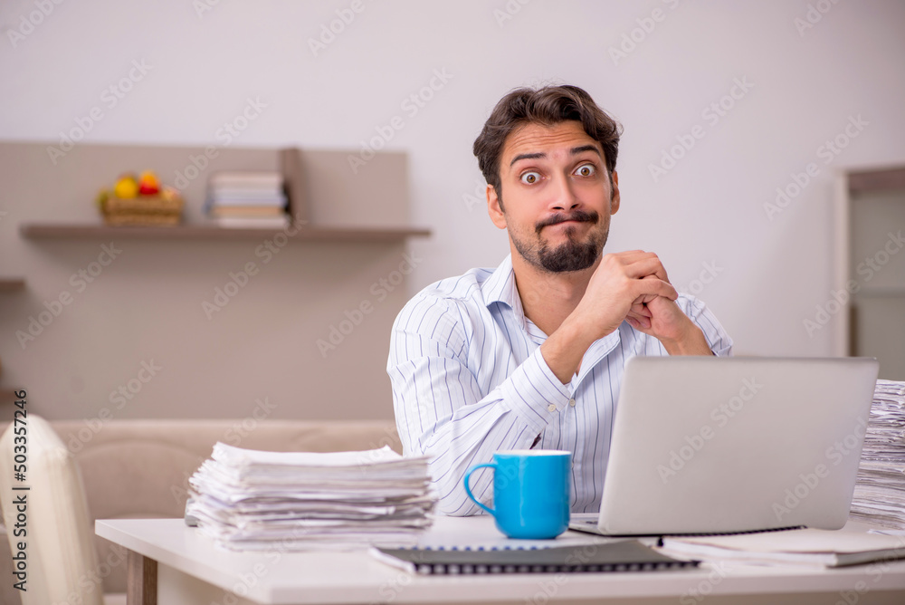 Young businessman employee working from home during pandemic Young businessman employee working from home during pandemic