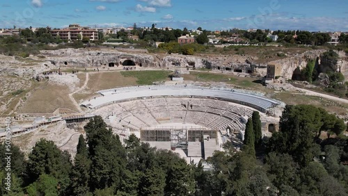 The Greek Theater of Syracuse is located on the southern slopes of Temenite Hill, overlooking the modern city of Syracuse in southeast Sicily. photo