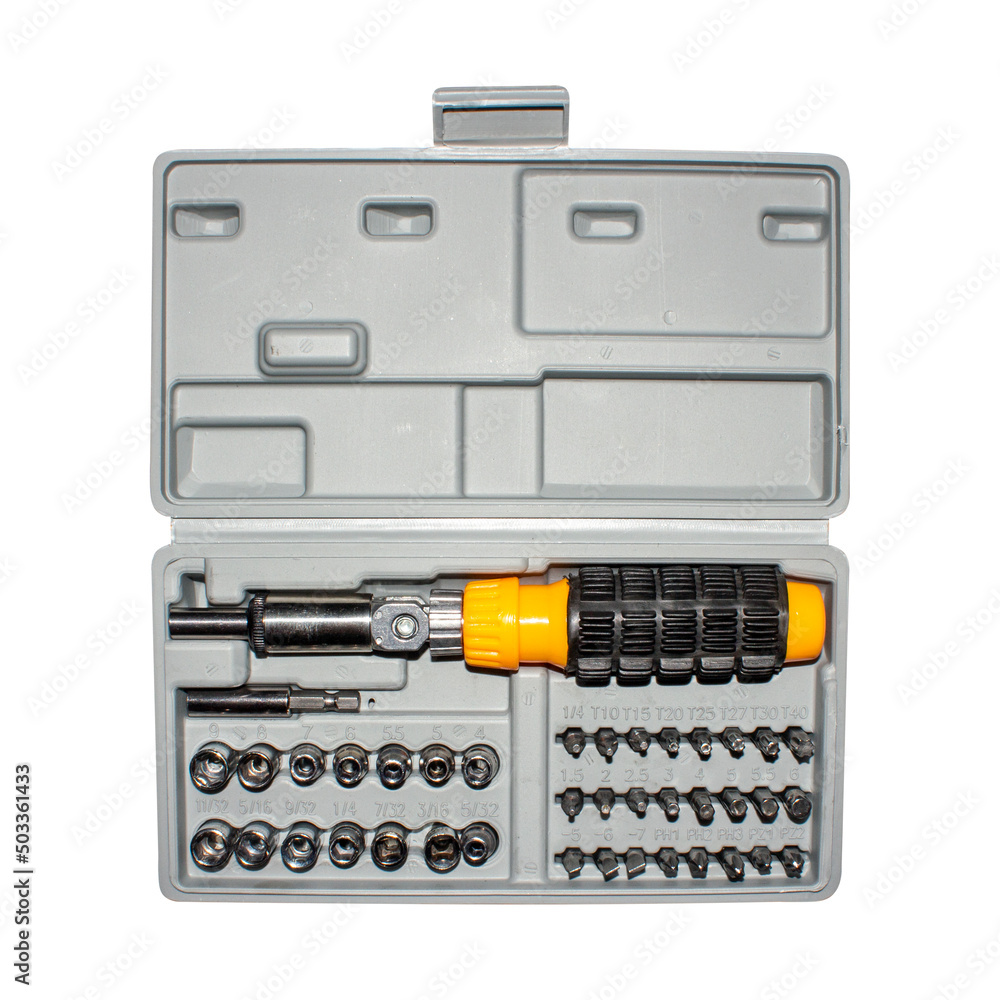 Multifunctional screwdriver in the suitcase.The screwdriver is a ratchet with many attachments. Multifunctional screwdriver in the suitcase.The screwdriver is a ratchet with many attachments.