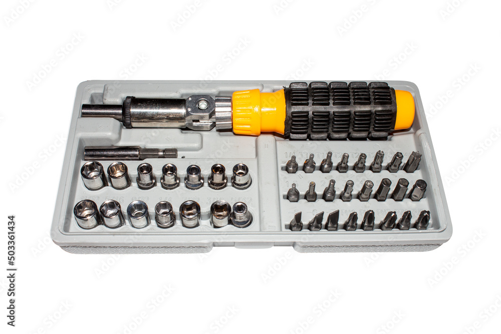 Multifunctional screwdriver in the suitcase.The screwdriver is a ratchet with many attachments. Multifunctional screwdriver in the suitcase.The screwdriver is a ratchet with many attachments.
