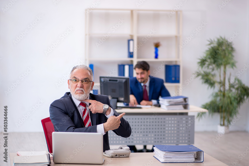 Two male colleagues working in the office Two male colleagues working in the office
