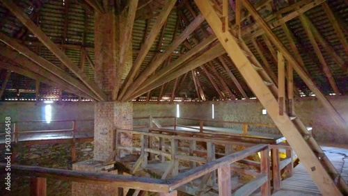 The interior of the medieval defensive tower of the Medzhybizh Castle with wooden roof, staircases and bridges, Medzhybizh, Ukraine photo