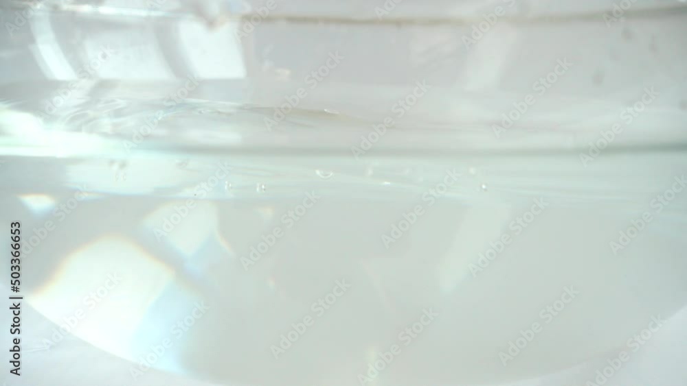 Falling sweet red pepper in a glass bowl of water. Slow motion. Falling sweet red pepper in a glass bowl of water. Slow motion.