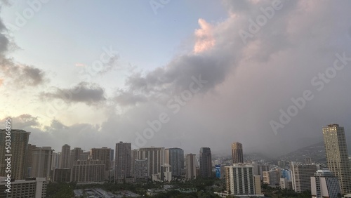 Pink sunset clouds over the city of Waikiki, Oahu Island, year 2022 May