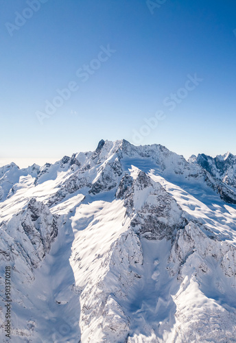 rocky mountains in snow and clear sky 