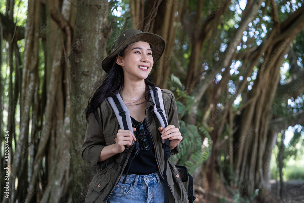 Asian young beautiful female backpacker traveling alone in forest wild. Asian young beautiful female backpacker traveling alone in forest wild.