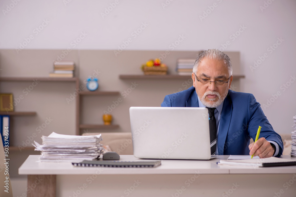 Old male boss working from home during pandemic Old male boss working from home during pandemic