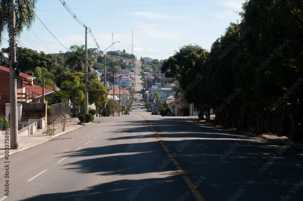Photograph of a street on a smite day Photograph of a street on a smite day
