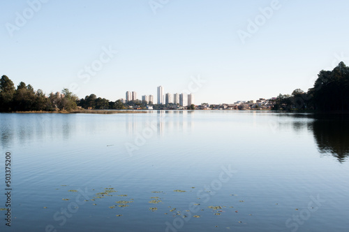 Photograph of a lake with the view of the big city