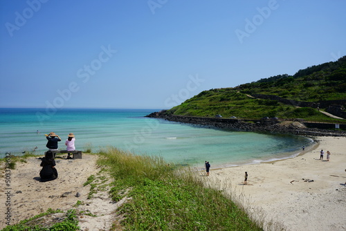 clear bluish beach and people