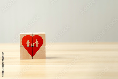 happy family concept of happiness, love. red heart symbol on wooden cube on beautiful background and copy space.