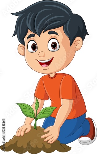 Cute little boy planting a plant