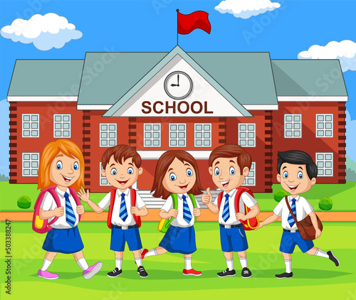 Happy school children in front of building school