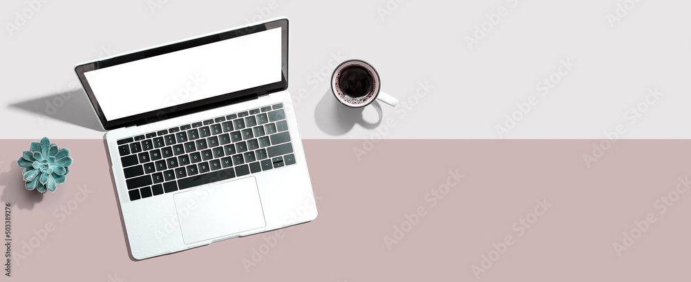 Laptop computer with a coffee cup from above Laptop computer with a coffee cup from above